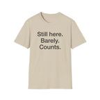 Still Here. Barely. Counts. — Funny Burnout Humor T-Shirt